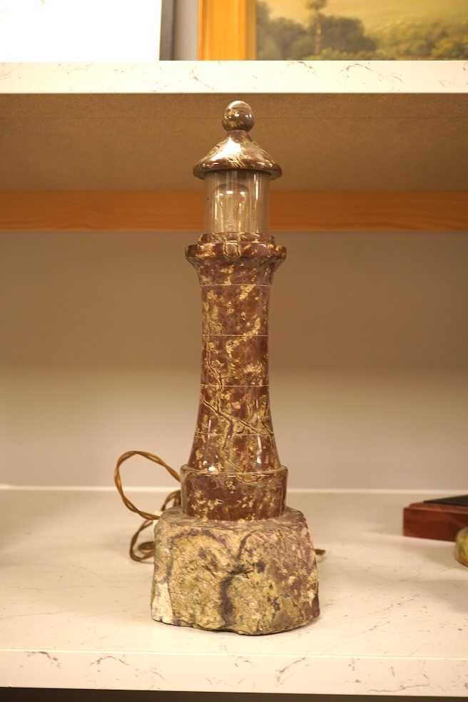 A serpentine lamp modelled as a lighthouse, 34cm high